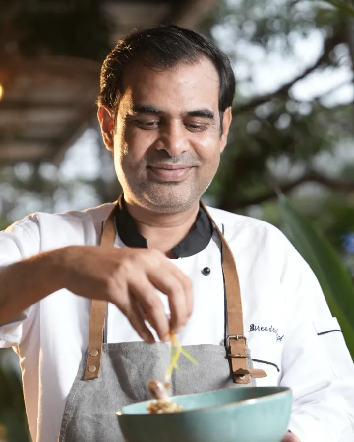 Chef Birendra Singh garnishing a dish