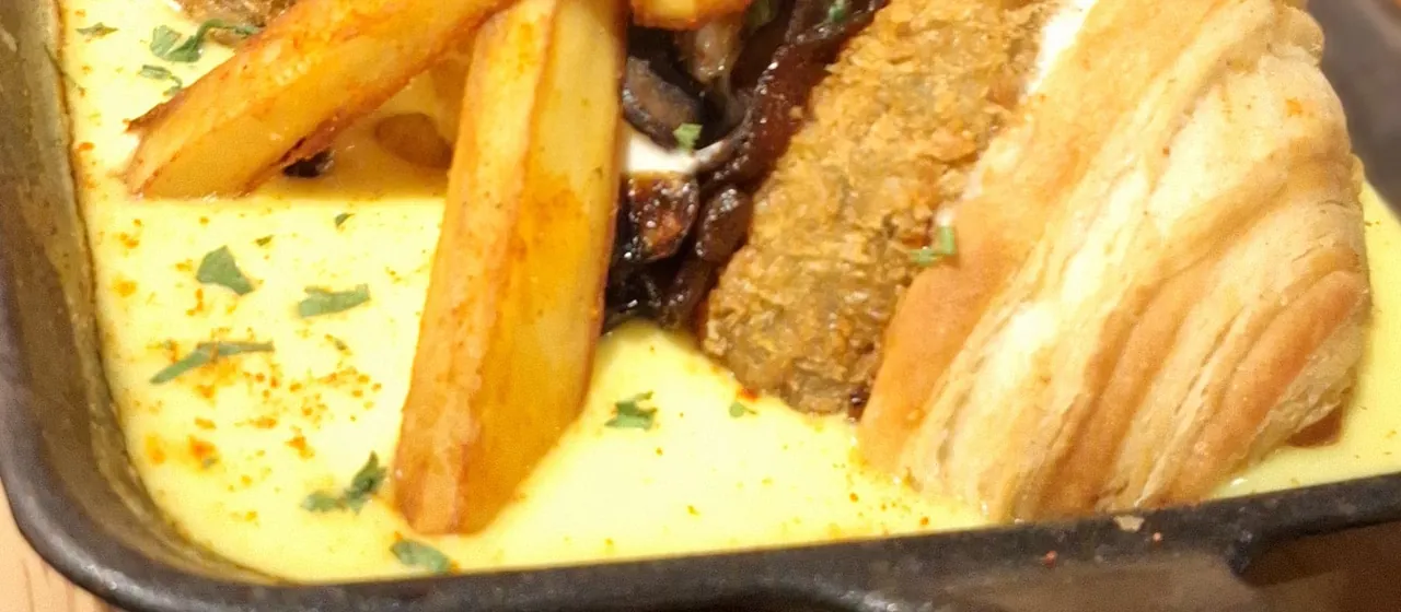 Burger and fries served in a skillet